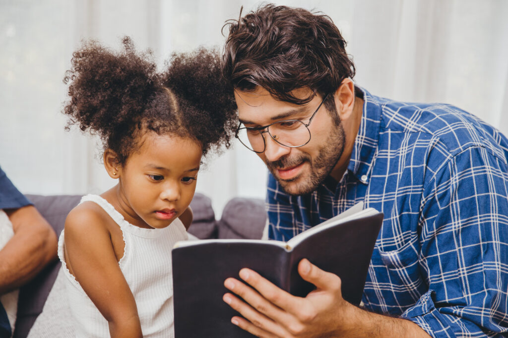 Homeschooling girl and dad reading and using other strategies to help increase her vocabulary 