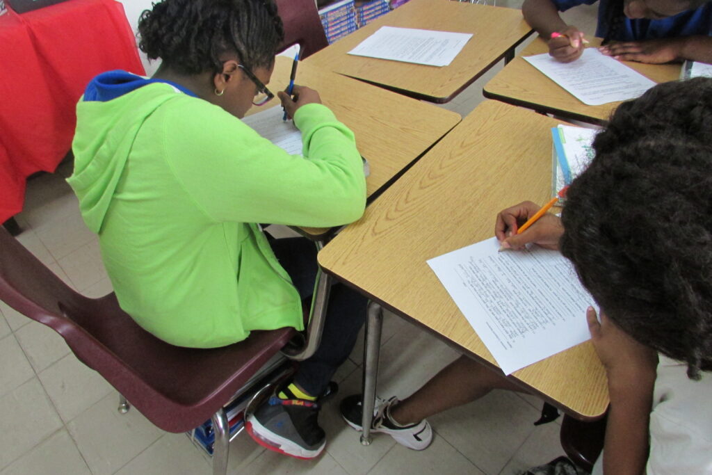 Students doing reflective writing 