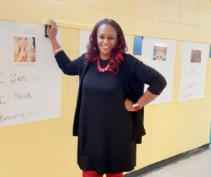 teacherpreneur standing by gallery walk