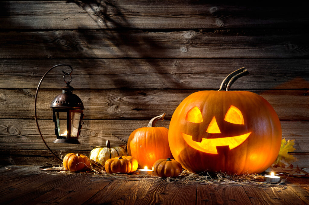 Halloween decoration pumpkin head jack lantern on wooden background