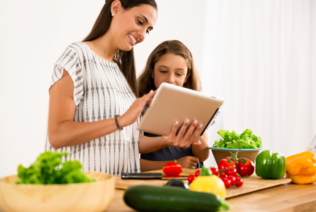 mom and daughter discussing meal planning & budgeting 