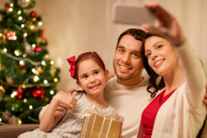 Family taking Christmas pictures