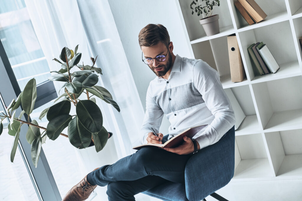 male teacher with plants in the classroom 