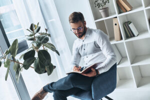male teacher with plants in the classroom