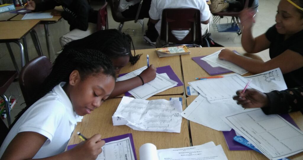 Students working in groups during Christmas holidays pleasant smelling classroom.