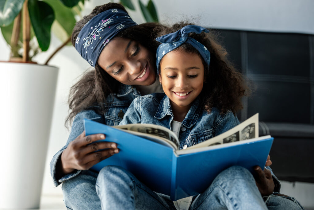 mom and daughter looking through book help increase critical thinking