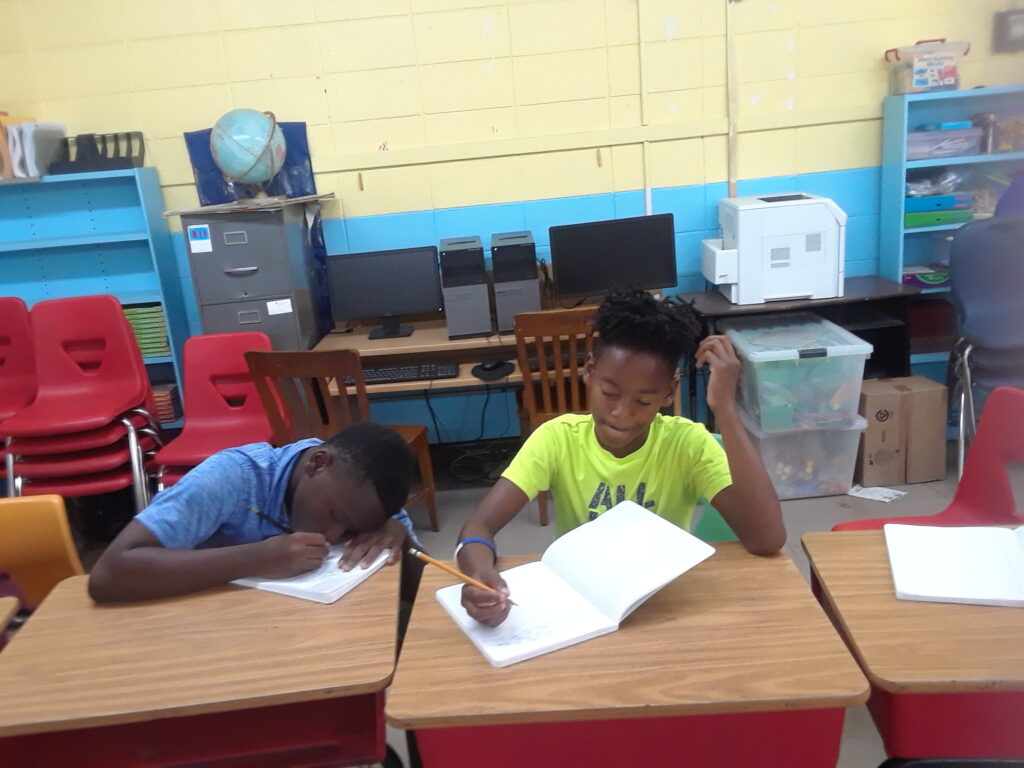 students writing in journals