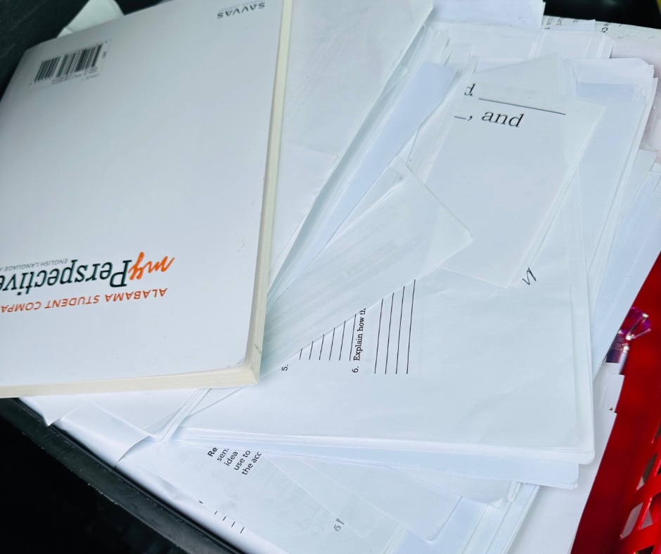 Messy paperwork that teacher has drug home from work