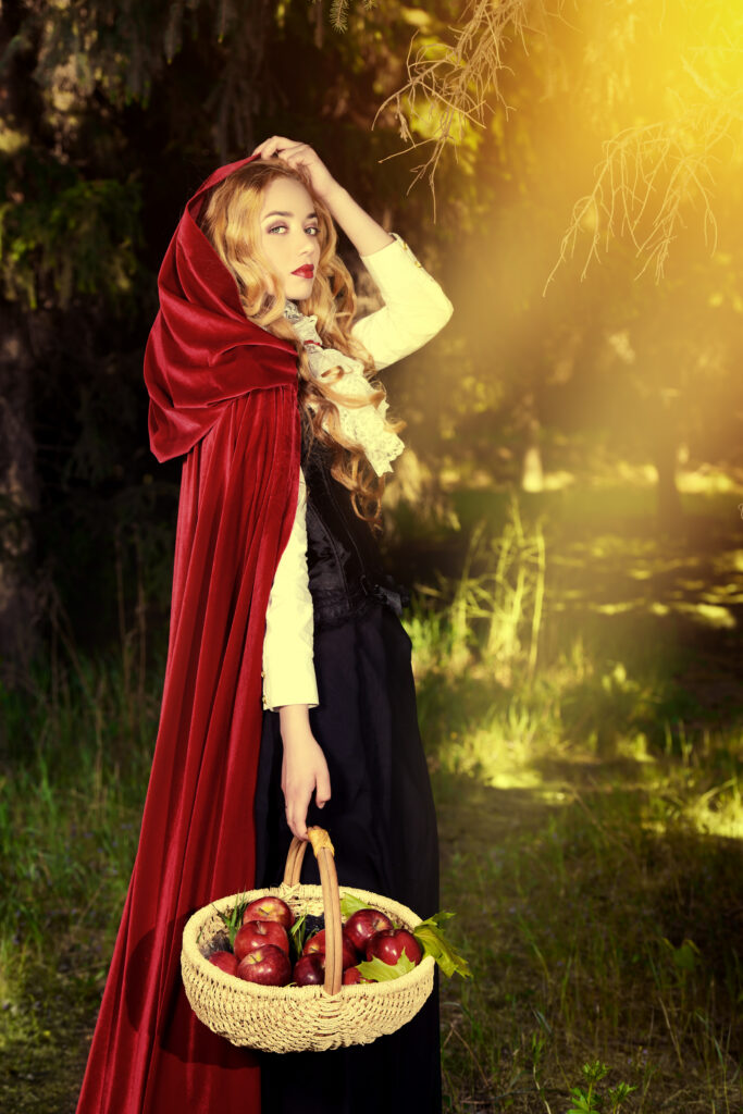 red riding hood with apples in basket