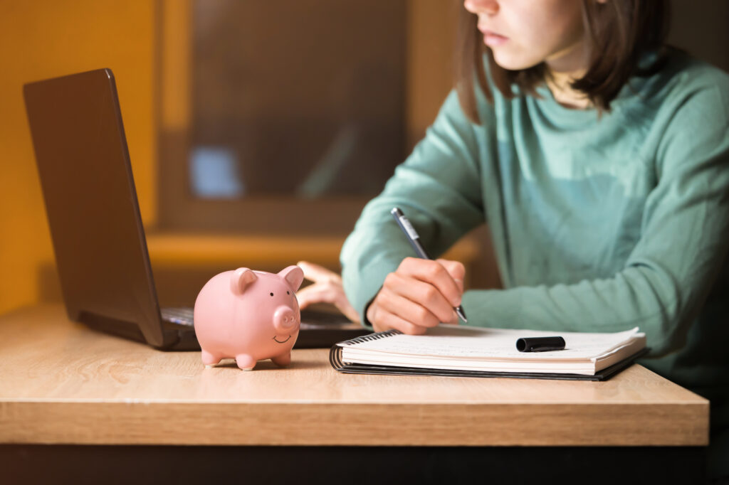 young girl working on a budget for the family reunion