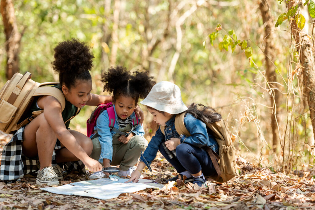 kids on a backyard scavenger hunt