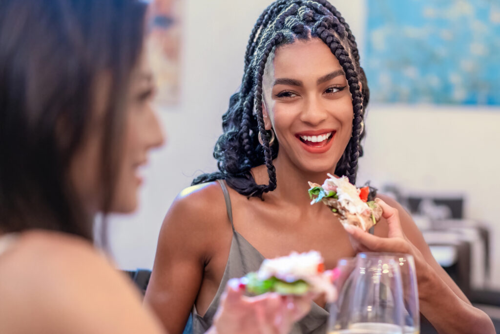women smiling at book club tea party for adults