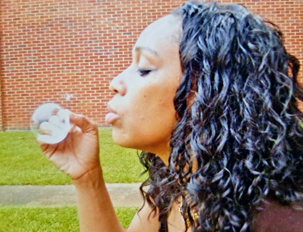 author blowing bubbles int he summertime 