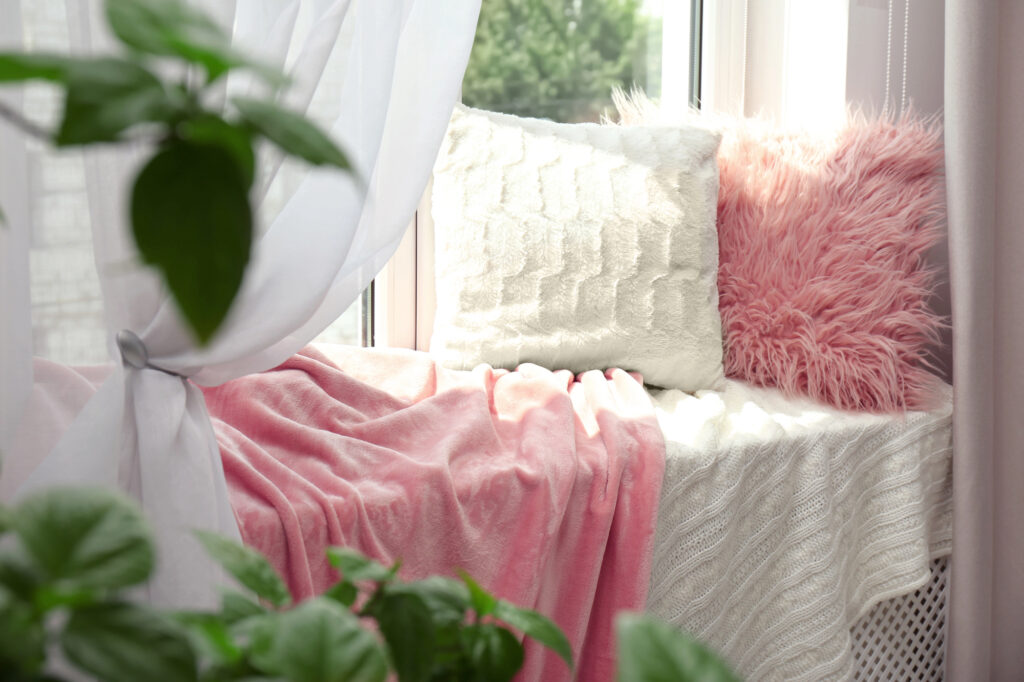 pink reading nook window ledge