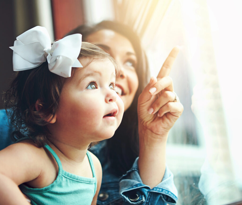 little girl and her mom birdwatching